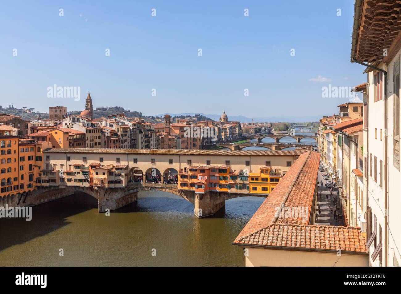 Ponte Vecchio over the Arno River and the Vasari Corridor (Corridoio Vasariano) in Florence Stock Photo