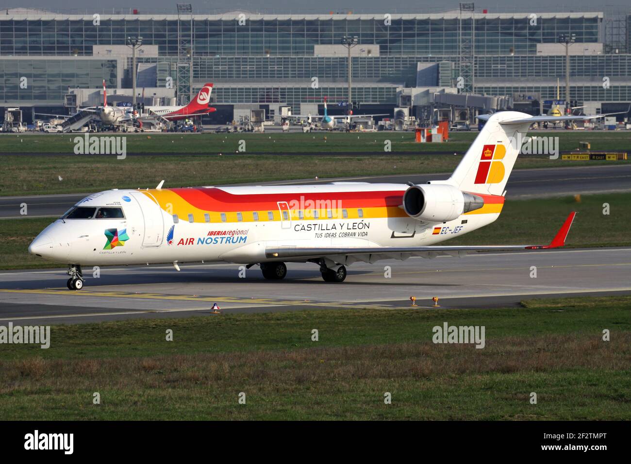 Spanish Air Nostrum Bombardier CRJ200 in Iberia Regional livery with registration EC-JEF on taxiway at Frankfurt Airport. Stock Photo