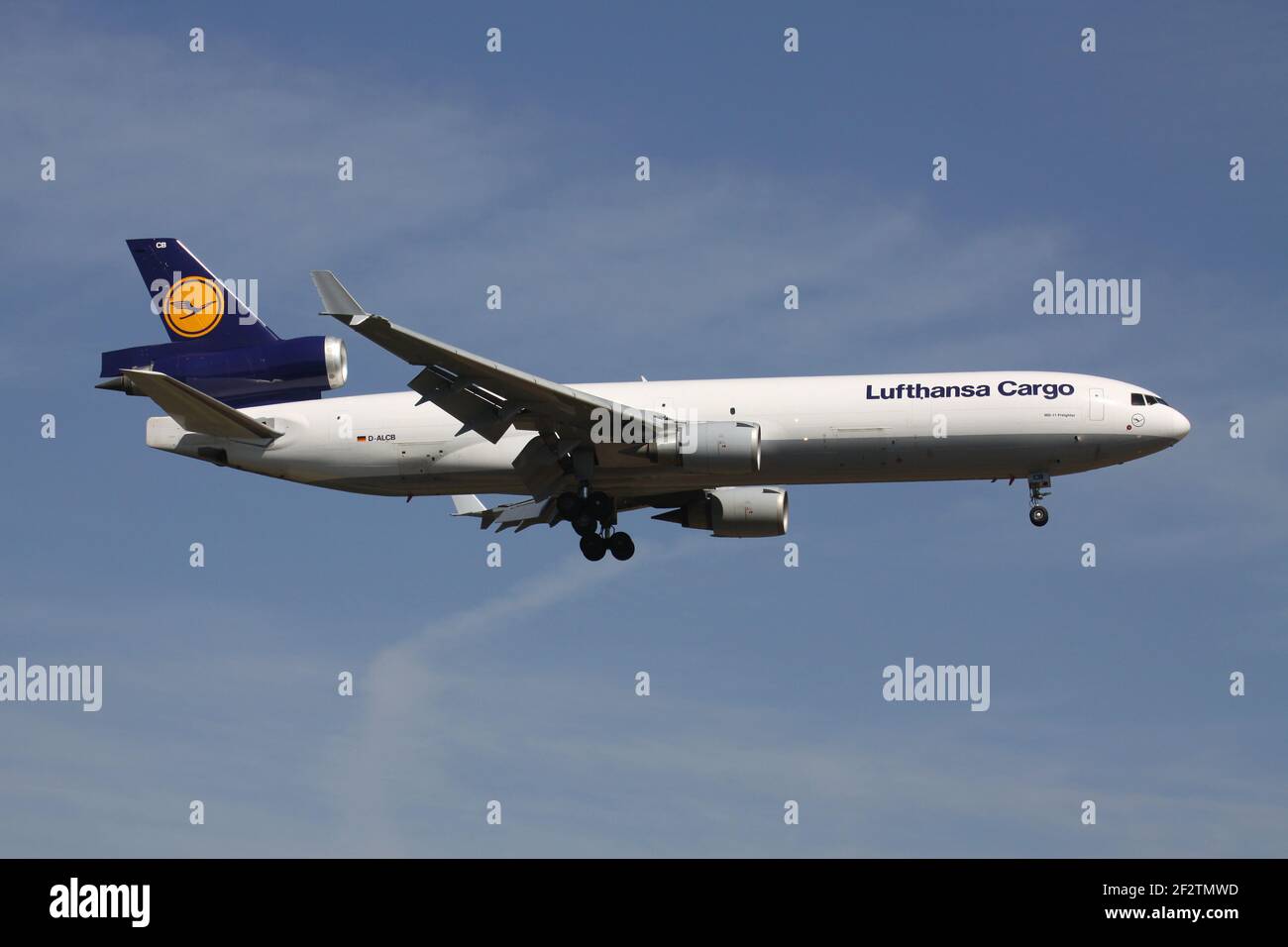 German Lufthansa Cargo McDonnell Douglas MD-11F with registration D-ALCB on short final for runway 07R of Frankfurt Airport. Stock Photo
