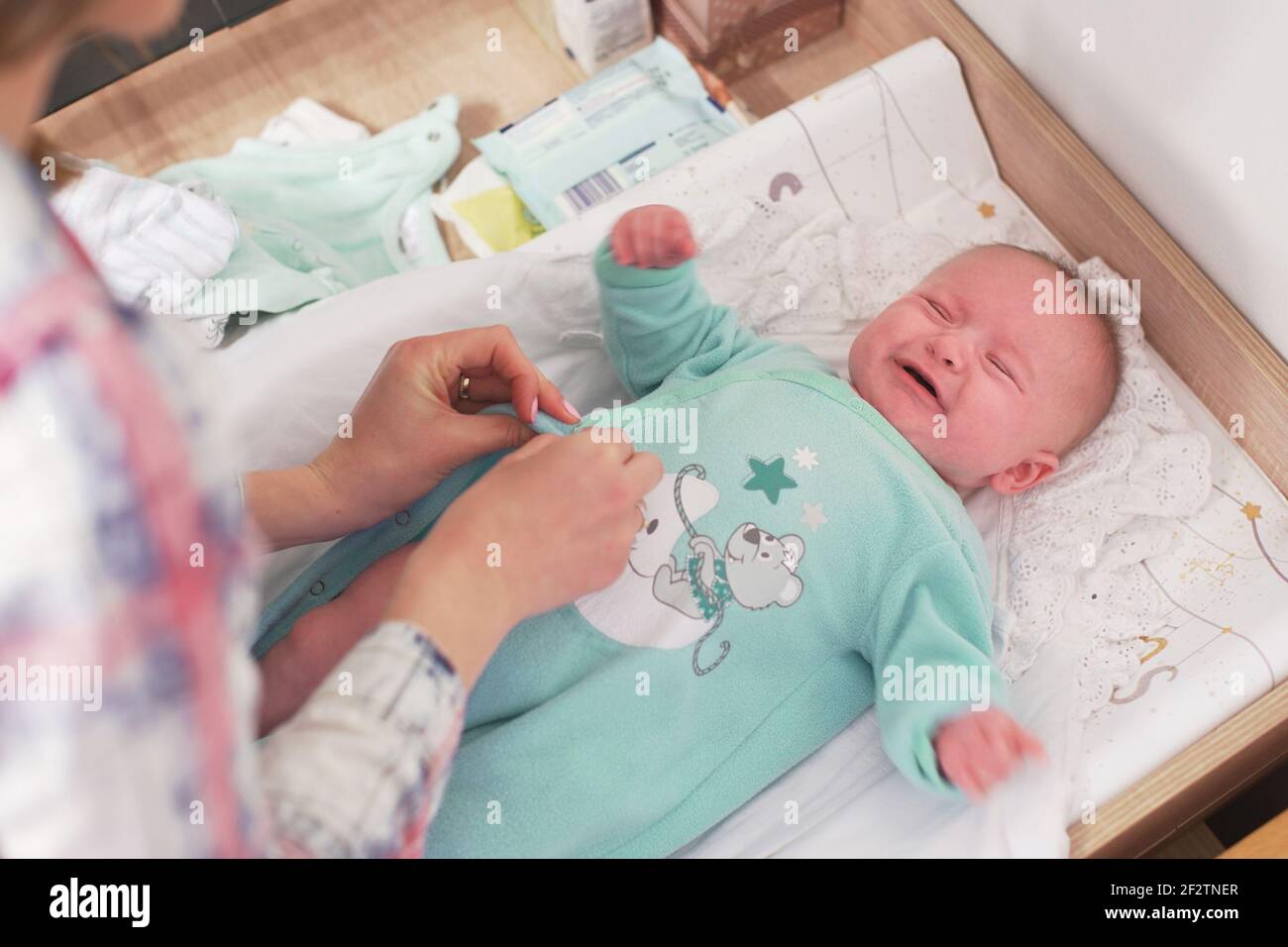 Baby mother change clothes diaper hires stock photography and images