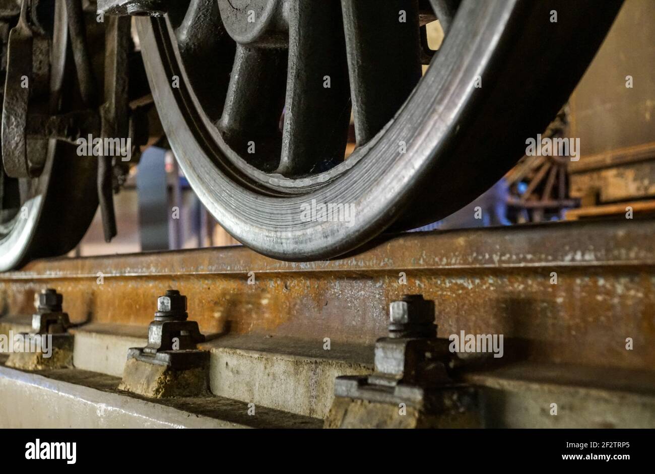 wheels of a railway train on rails close up, cargo transportation Stock Photo