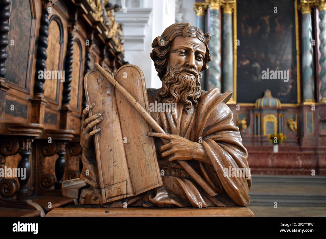 Friedrichshafen, Baden-Württtmberg, Germany. Schlosskirche. Interior. Left choir stalls. Moses with tablets of the law and staff. Stock Photo
