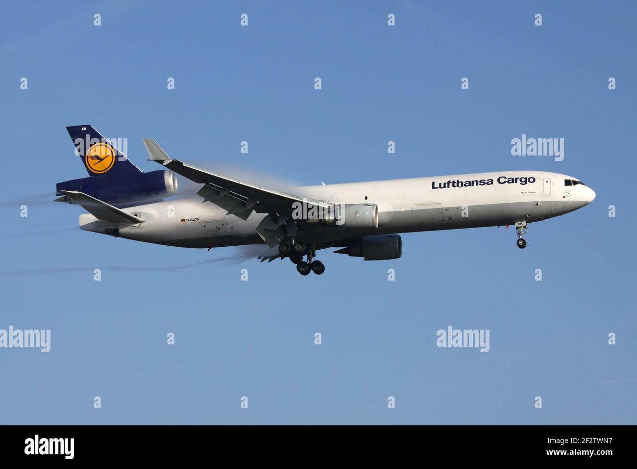 German Lufthansa Cargo McDonnell Douglas MD-11F with registration D-ALCK on final for runway 07R of Frankfurt Airport. Stock Photo