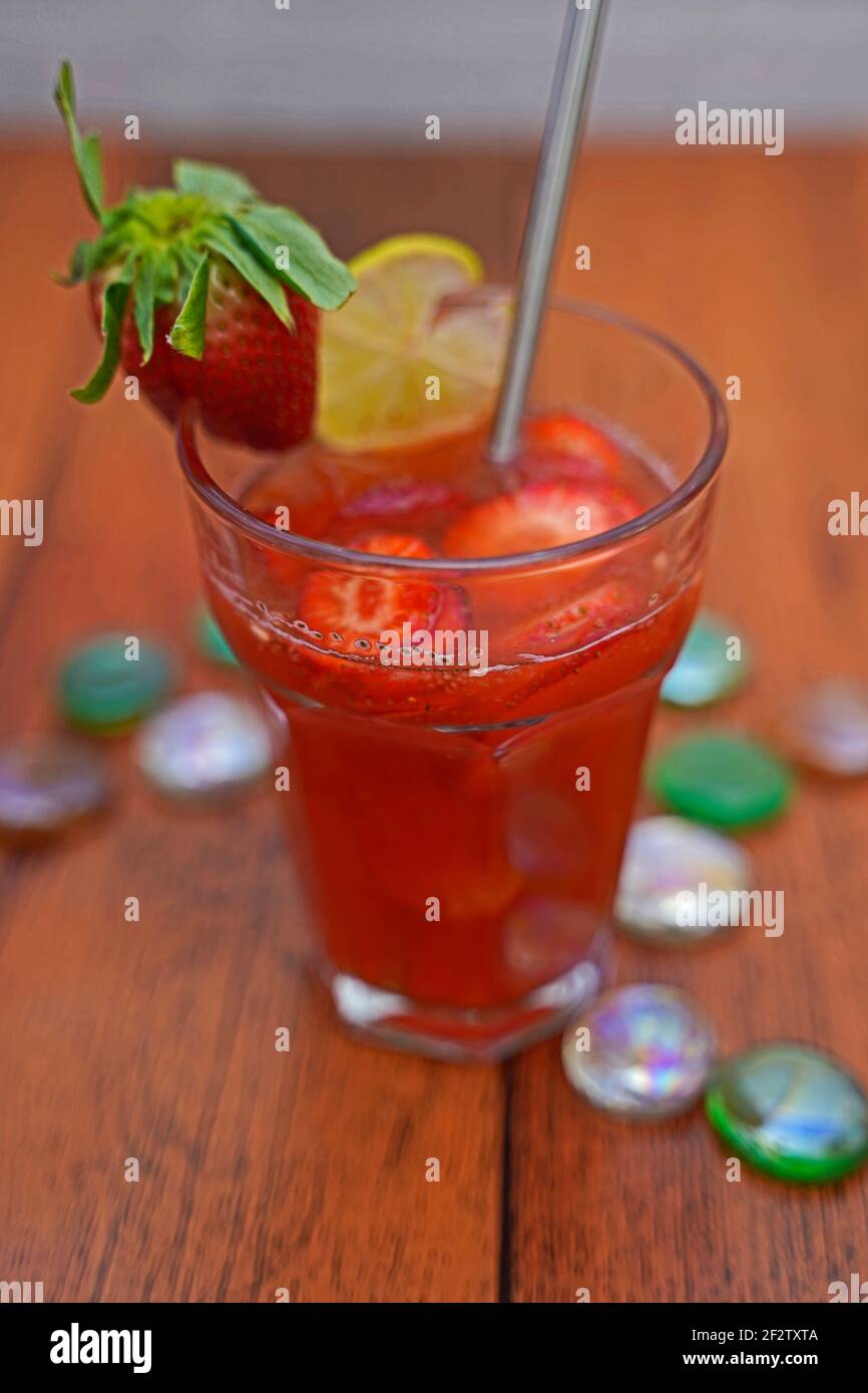Strawberry meets orange and tequila . tasty and fruity cocktails served in glasses Stock Photo