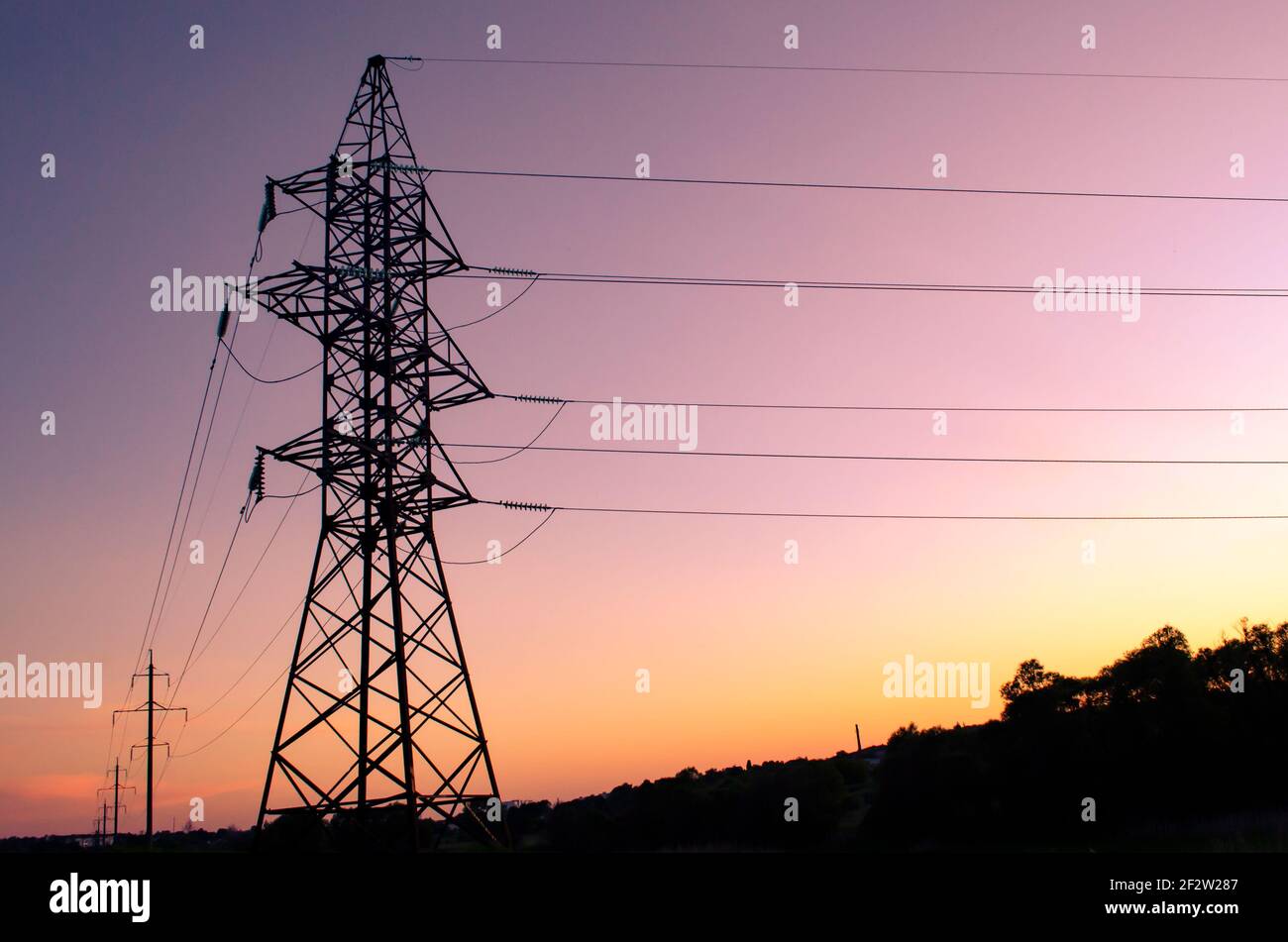 high voltage post. High-voltage tower sky background. Stock Photo