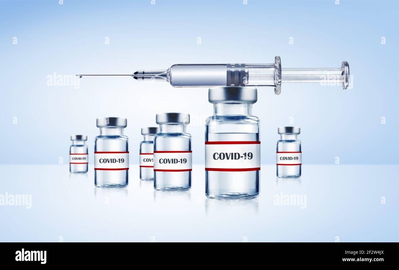 Impfstofflaschen Covid-19 und Spritze Stock Photo
