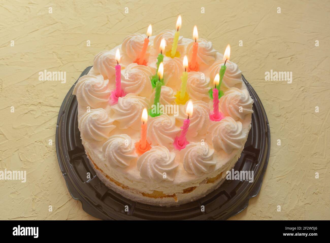 Cake with lit candles for birthday of eleven years. Selective focus, fog view. Stock Photo
