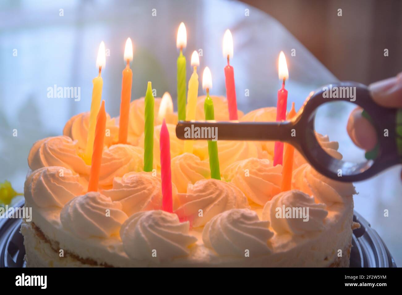 Candles are lit on birthday cake. Close-up, blur, fog Stock Photo - Alamy