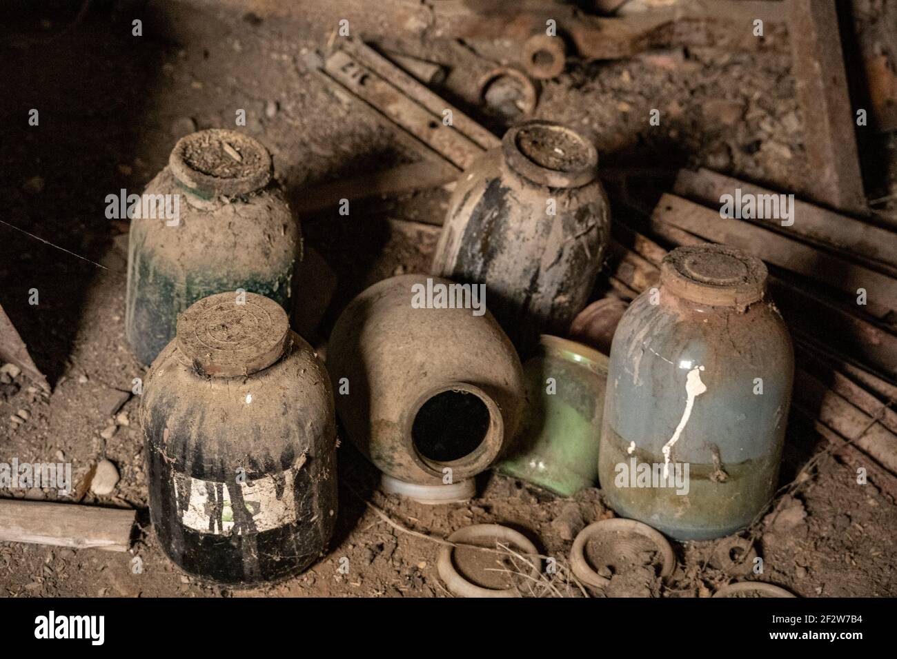 scrap metal parts and old rusty tools in abandoned workshop ancient ...