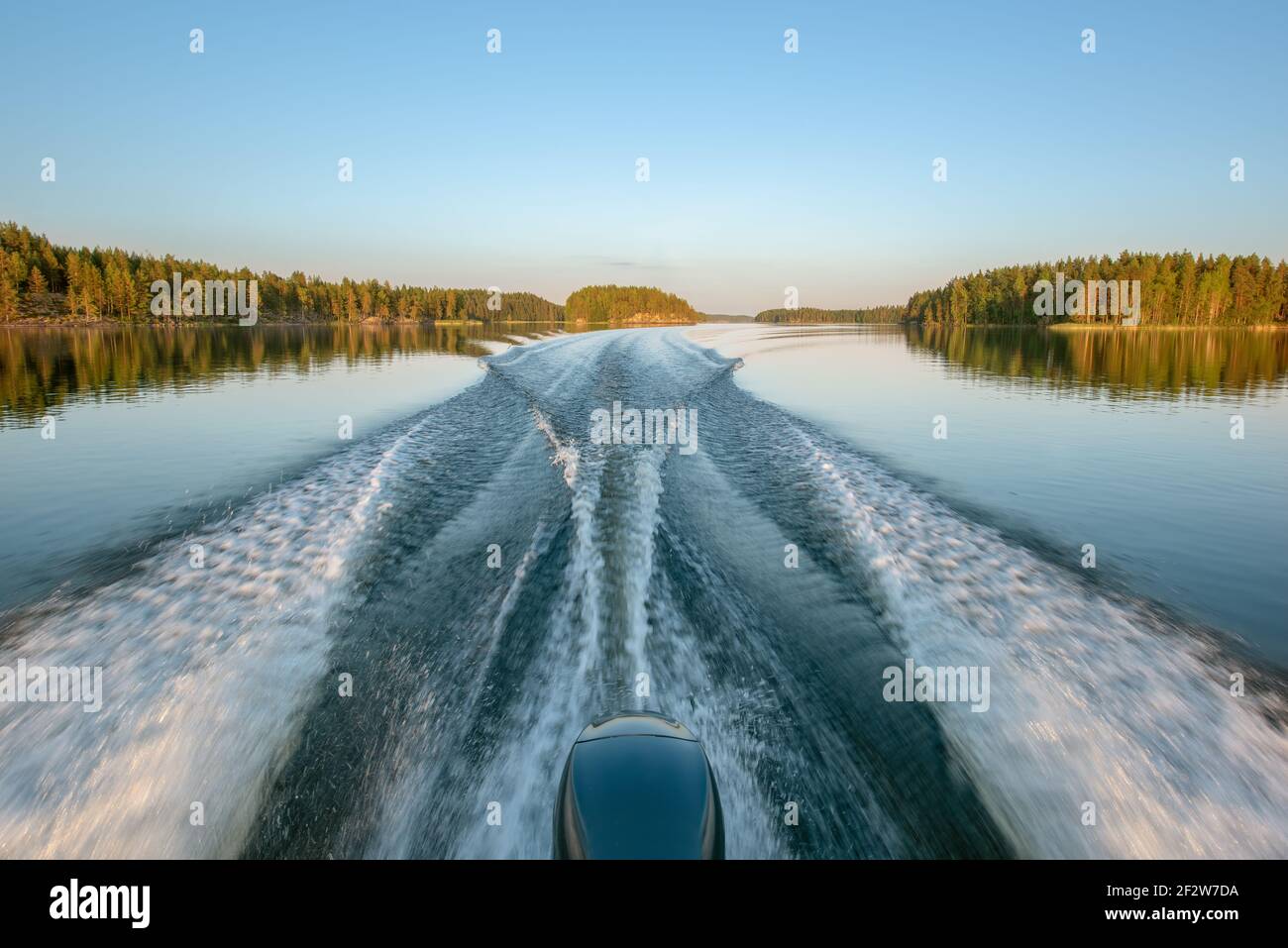 A trail on water surface behind a fast-moving motorboat Stock Photo - Alamy