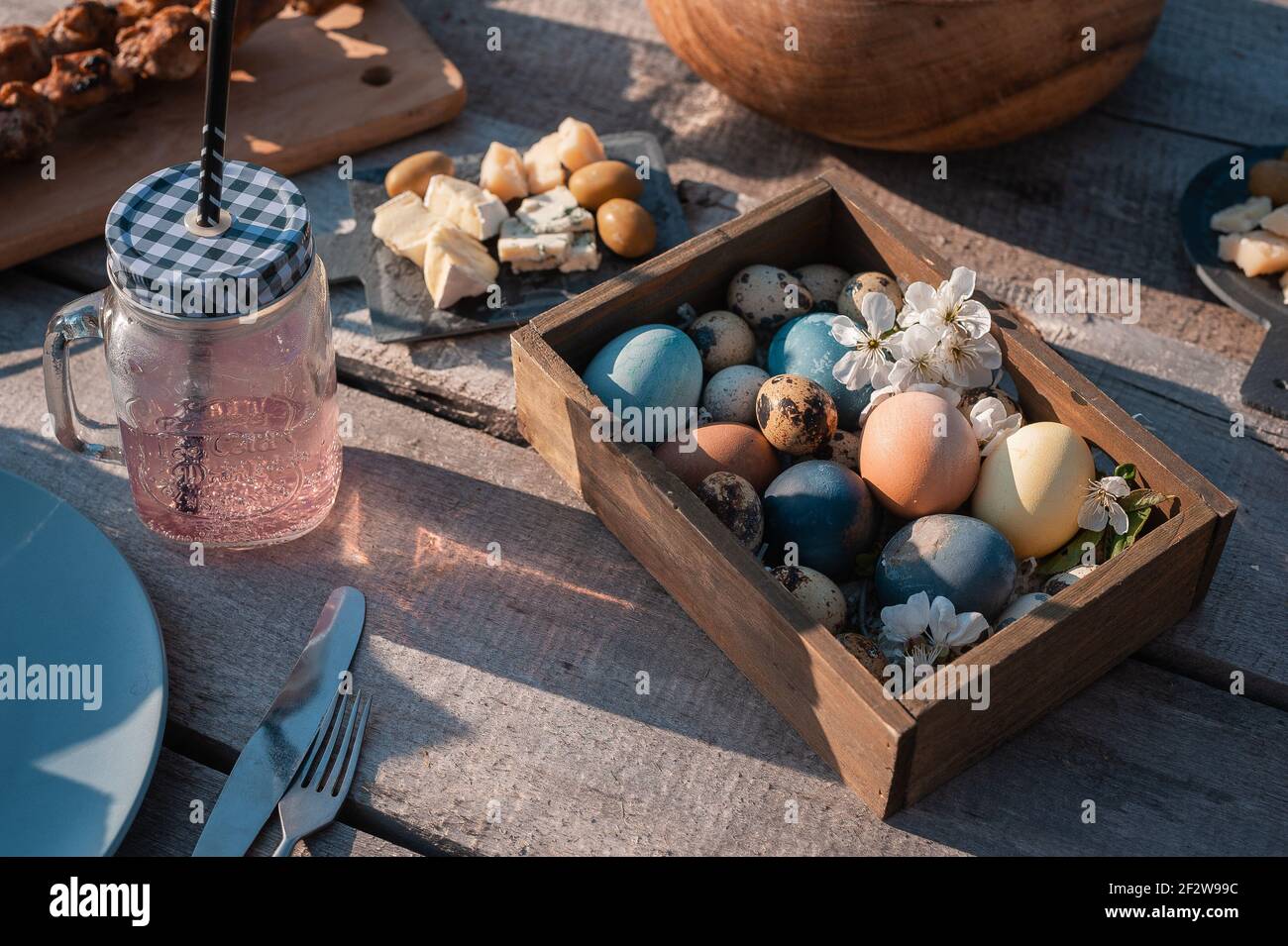 Decor of easter eggs on a wooden table in a wooden frame Stock Photo ...