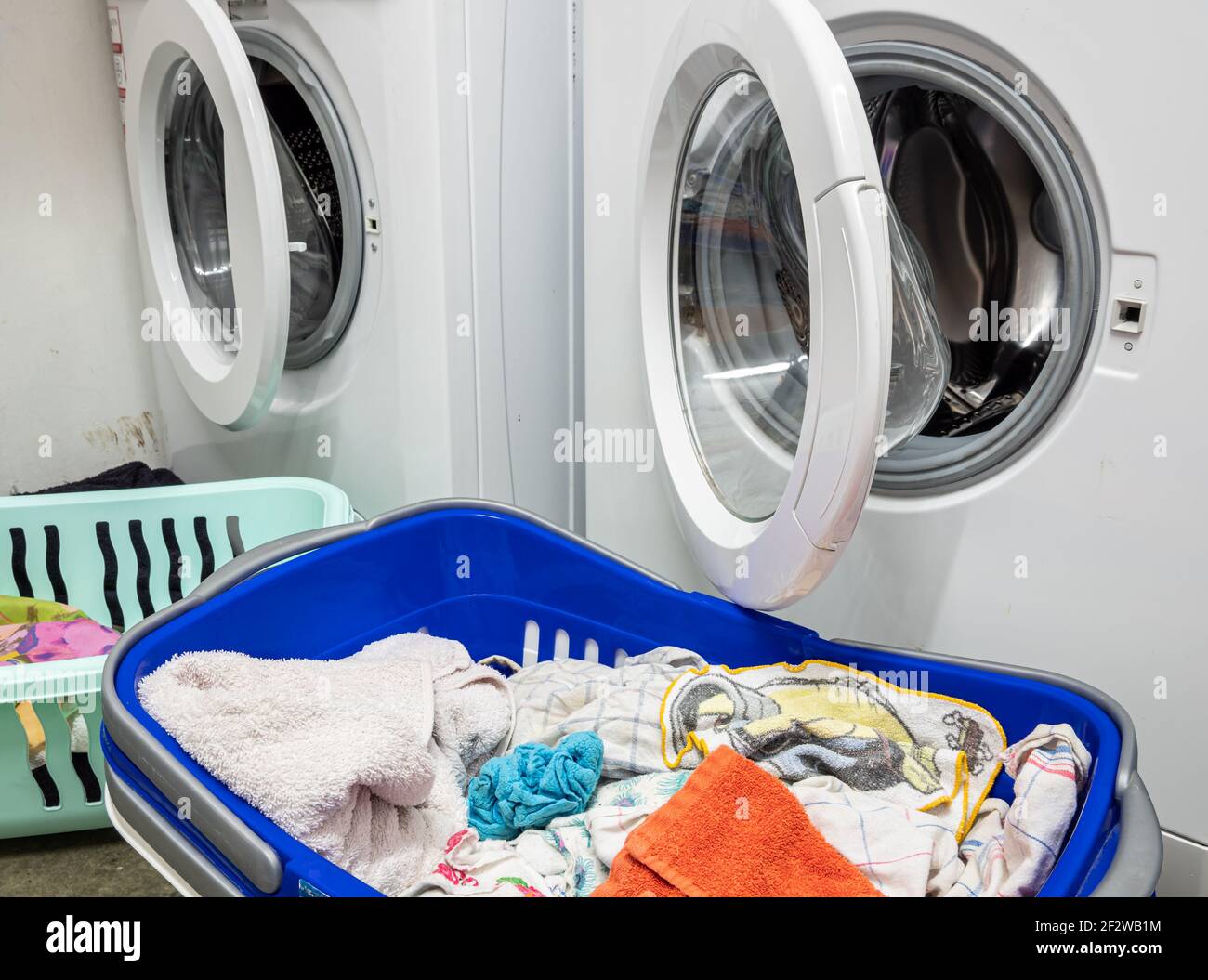 Washing machine and laundry basket at home Stock Photo