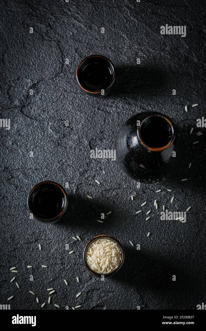Black ceramics and rice to make sake. Japanese cuisine Stock Photo Alamy