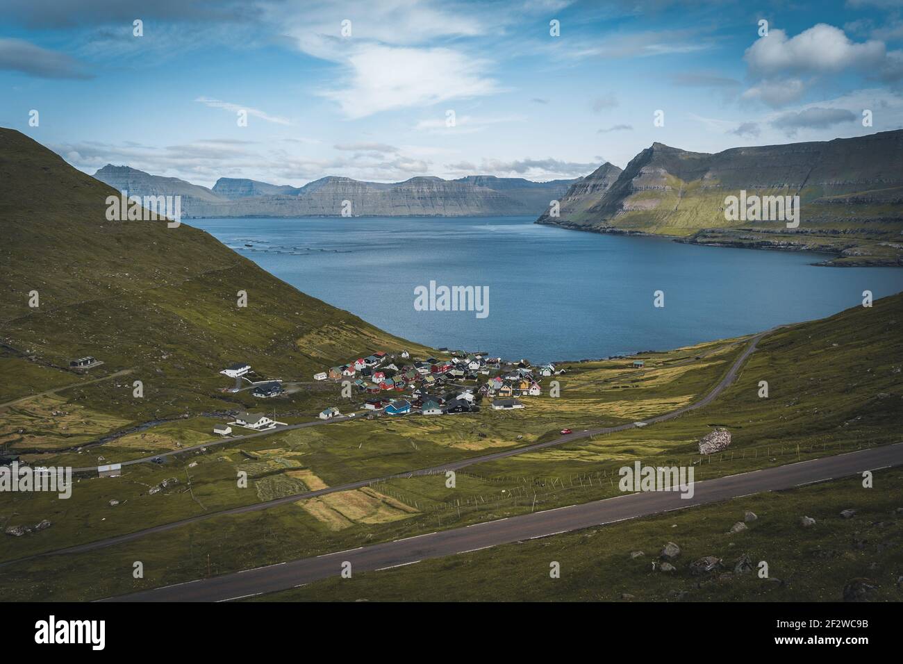 Spectacular views of the scenic fjords on the Faroe Islands near the village Funningur with mountains during a sunny spring day. Stock Photo