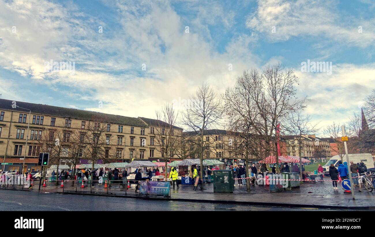 Glasgow, Scotland, UK. 13th March, 2021. UK  Weather: Torrential Rain and heavy winds with more to come saw sunny intervals with spring in the air over the city. A farmers market in partick west end was packed in the sunshine.  Credit: Gerard Ferry/Alamy Live News Stock Photo
