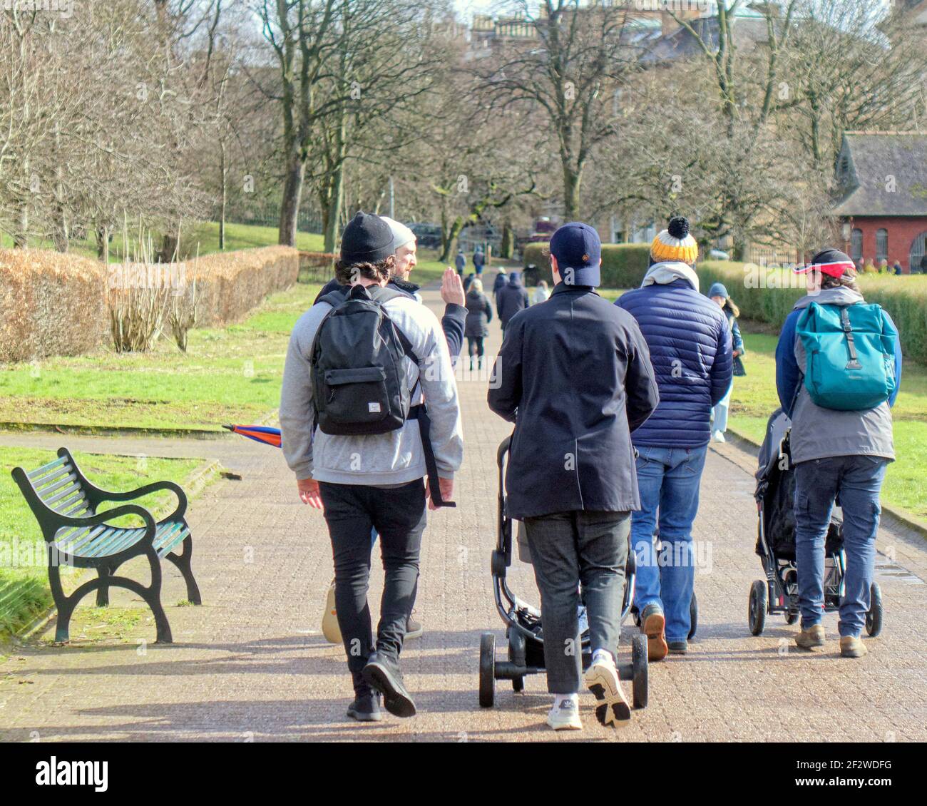 Glasgow, Scotland, UK. 13th March, 2021. UK  Weather: Torrential Rain and heavy winds with more to come saw sunny intervals with spring in the air over the city Kelvingrove park is packed with nice families in the affluent west end.. Credit: Gerard Ferry/Alamy Live News Stock Photo