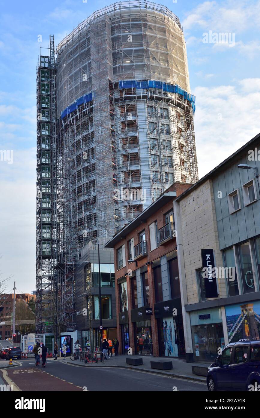 Newish private high rise tower building with flats having cladding removed to meet fire safety standards in new building code, UK Stock Photo