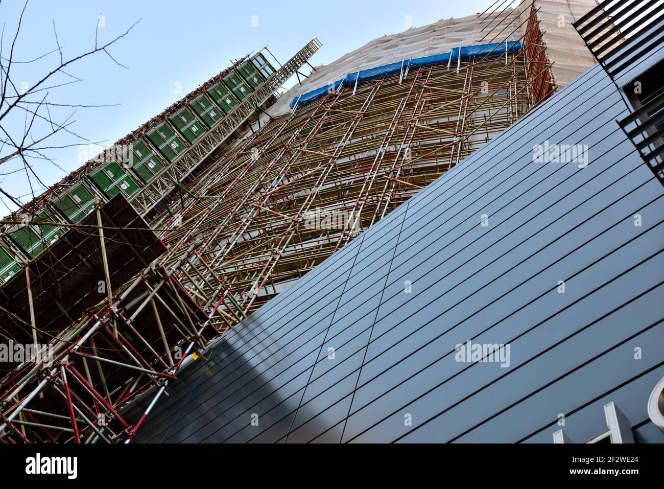 Newish private high rise tower building with flats having cladding removed to meet fire safety standards in new building code, UK Stock Photo