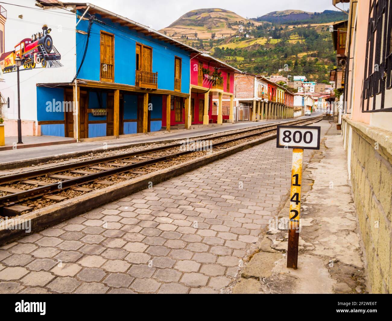 Stunning row of typical colorful houses in Alausi railway station, starting-off point for Devil's Nose train in Ecuador Stock Photo