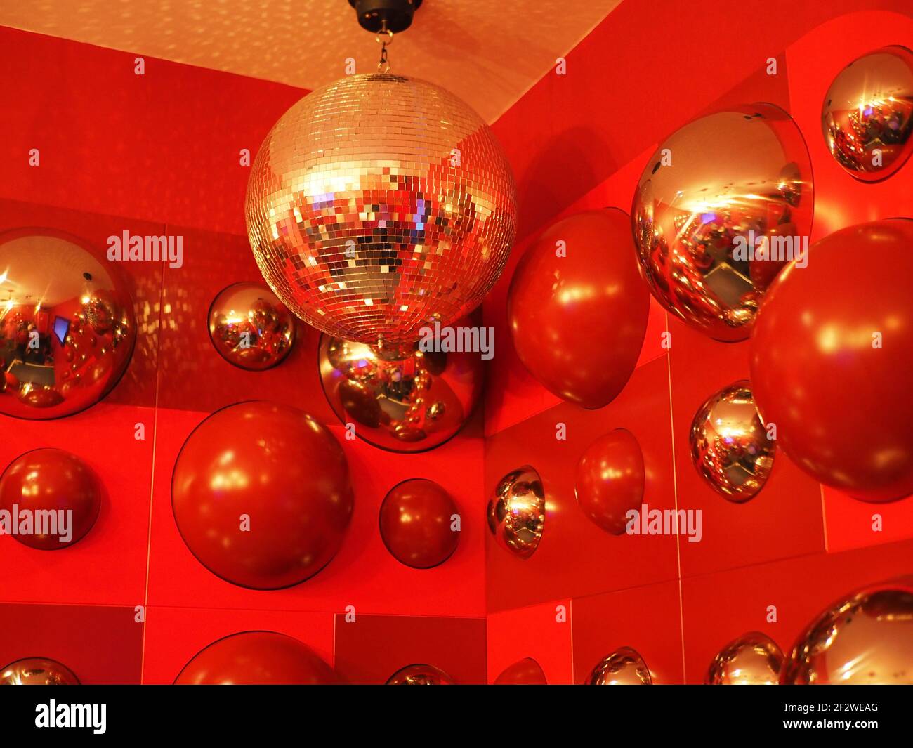Disco Balls with a Red background reminds you of the 70's era Stock