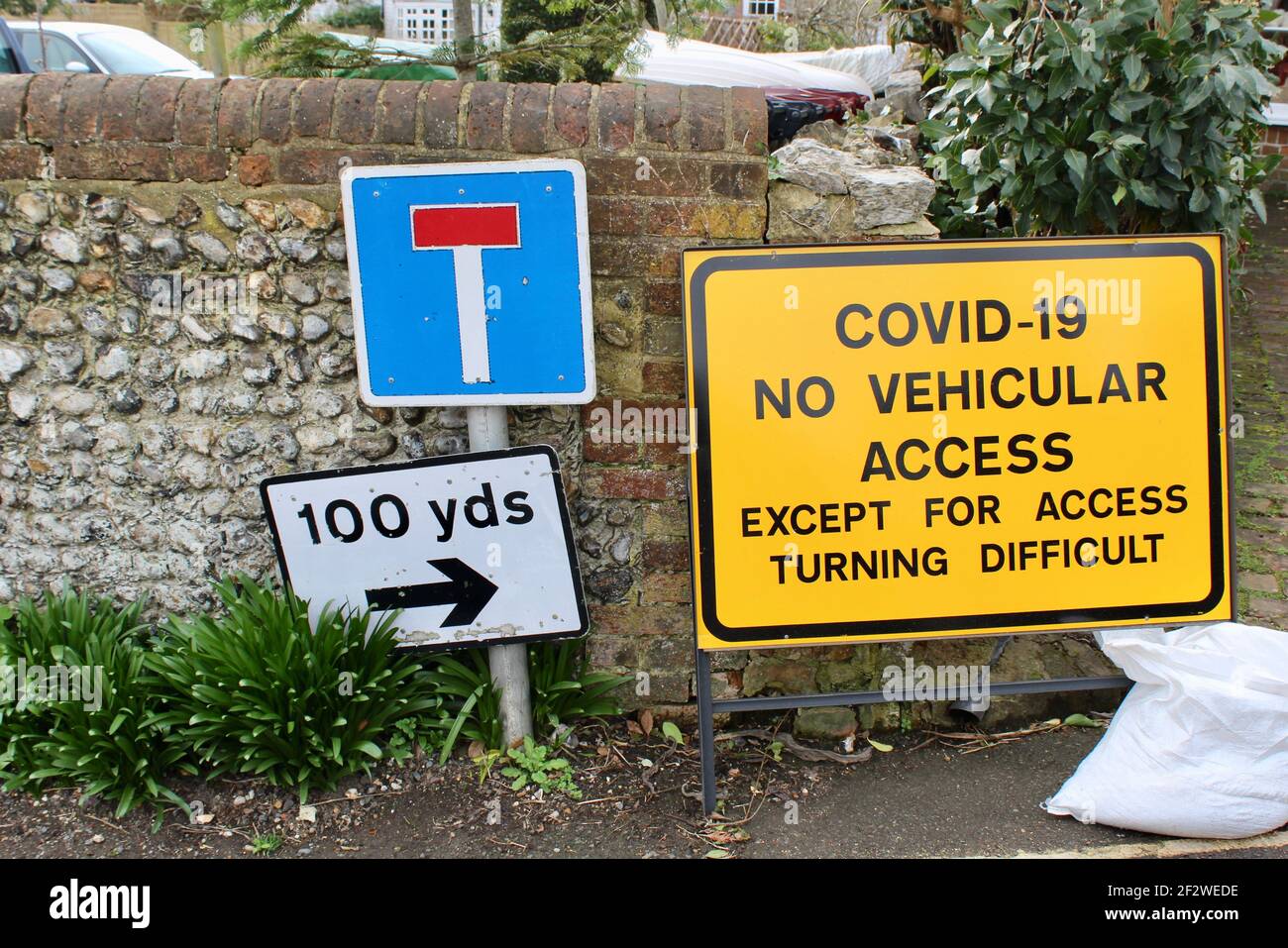 Covid 19, No Vehicular Access, Except For Access, Turning Difficult. Covid road sign advising of potential risk as turning is difficult. Stock Photo