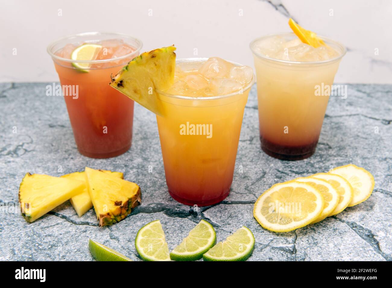 Mixed drink cocktails showing the graduated color of ingredients with the cup garnished with