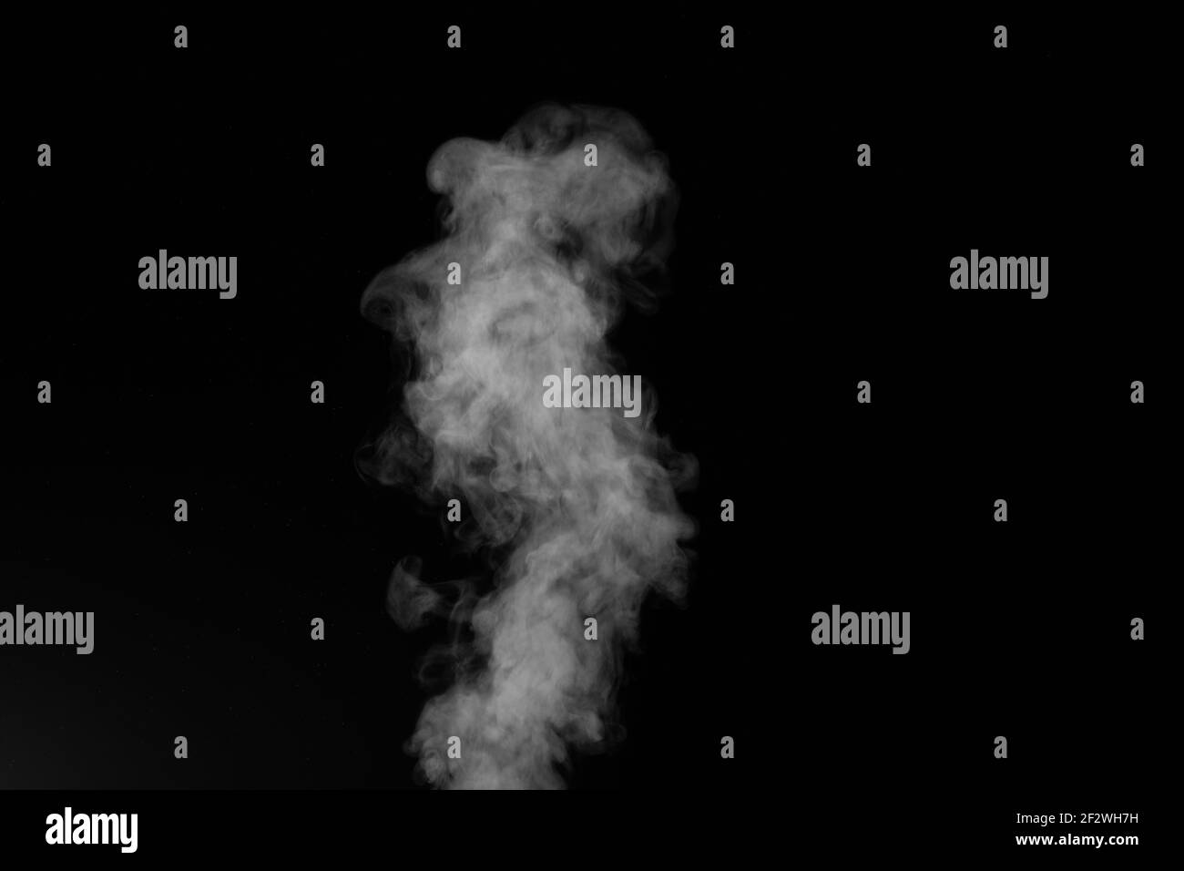 Figured smoke on a dark background. Abstract background, design element, for overlay on pictures. Stock Photo