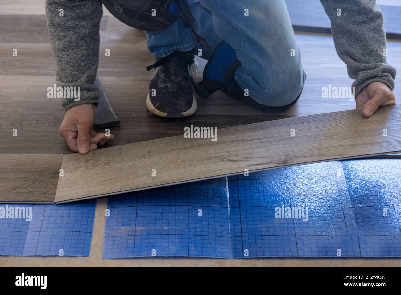 Curated visual reference: Gallery Detail: Installing Laminate Flooring In The Apartment Stock Photo