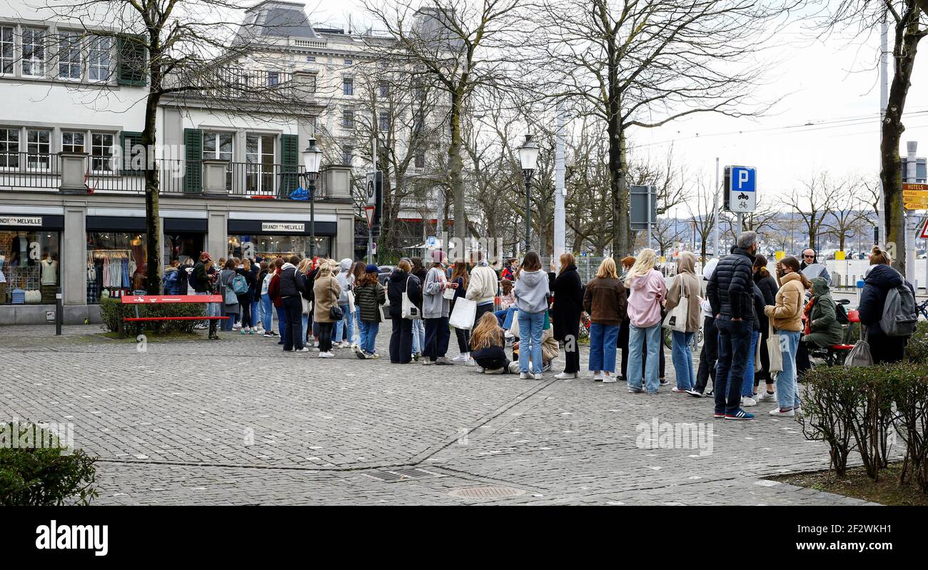 Shoppers queue in front of a clothing store of Italian brand Brandy  Melville, as the spread