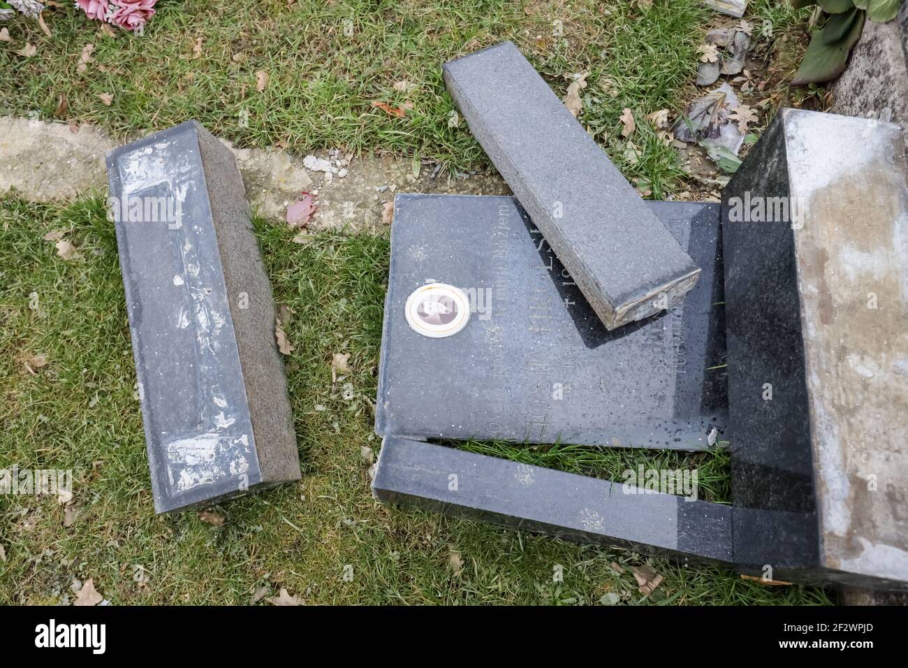 Destroyed gravestone in the cemetery after strong earthquake 6.2 in village Sela, near Sisak town. Stock Photo