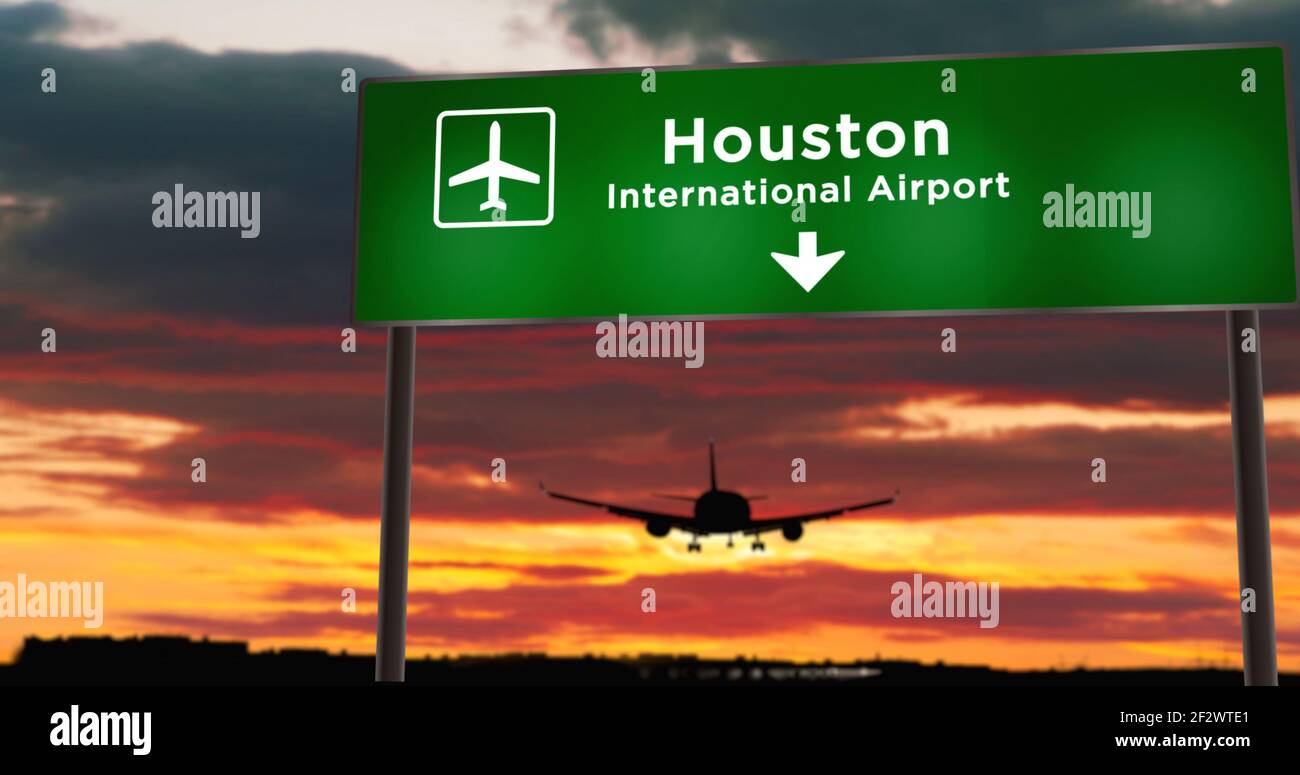 Airplane silhouette landing in Houston, Texas, USA, United States. City arrival with airport direction signboard and sunset in background. Trip and tr Stock Photo