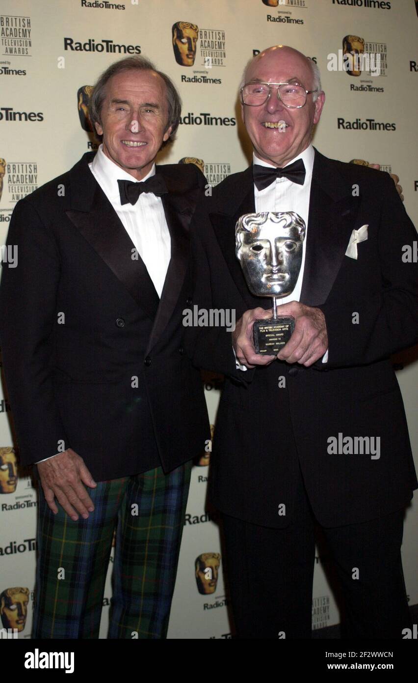 File photo dated 21-04-2002 of motor racing commentator Murray Walker (right) and Jackie Stewart after receiving a special award for his contribution to British Television at the British Academy Television Awards. Issue date: Sunday March 13, 2021. Stock Photo