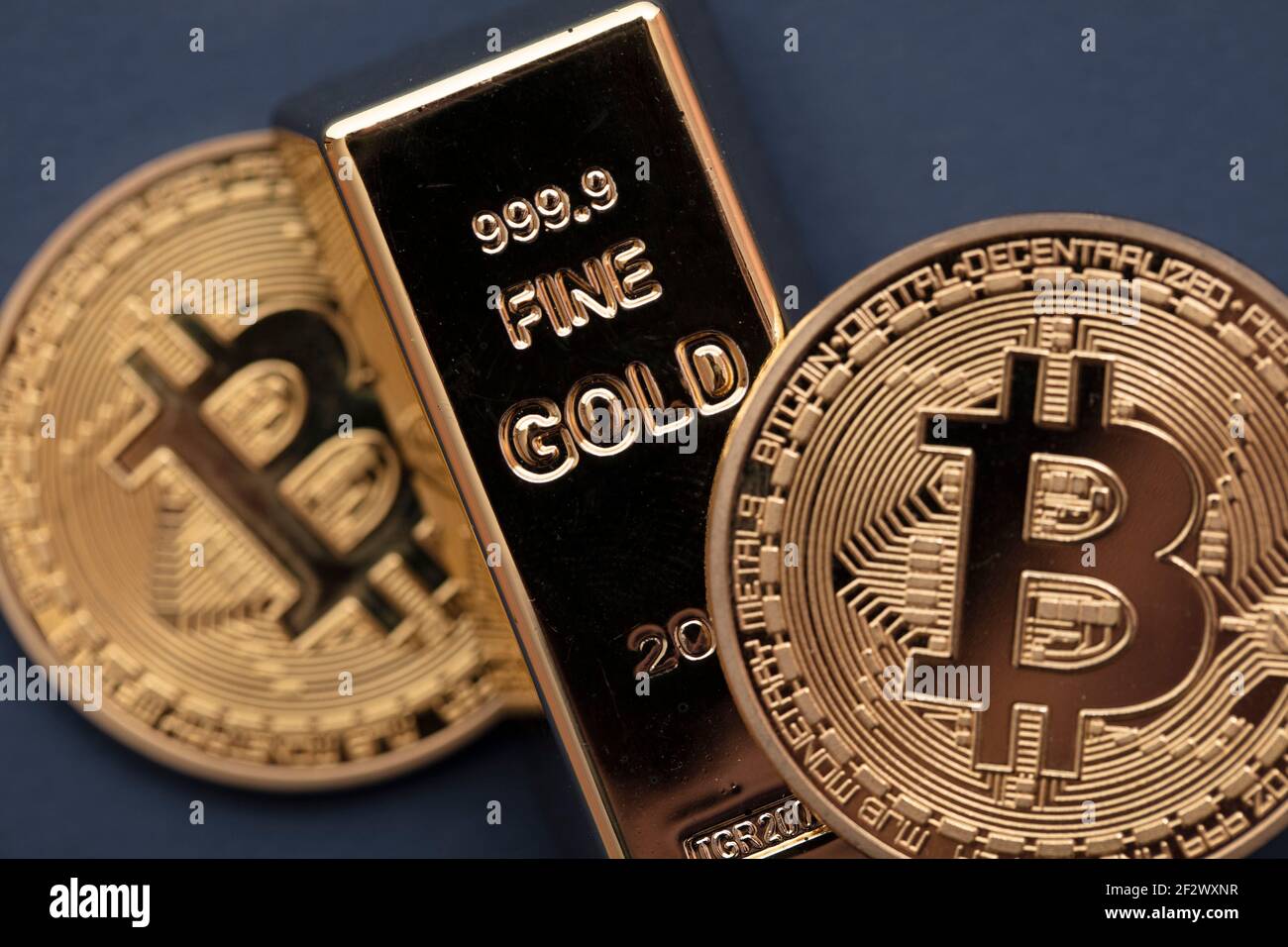 Bitcoin cryptocurrency coin with a gold bullion bar. Investment concept  Stock Photo - Alamy