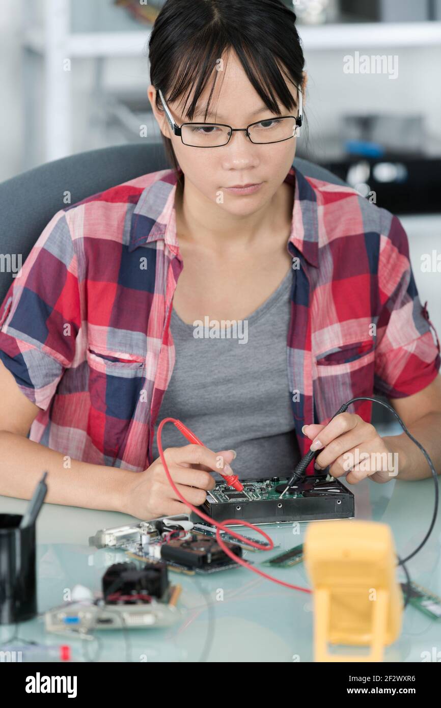 female technician working on power supply from pc Stock Photo Alamy