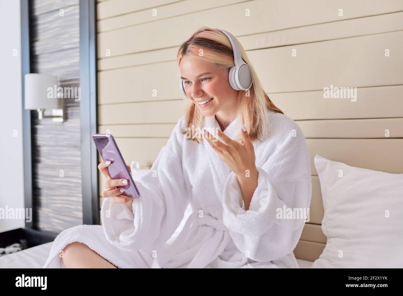 Online communication, video call, teenage girl in headphones with ...