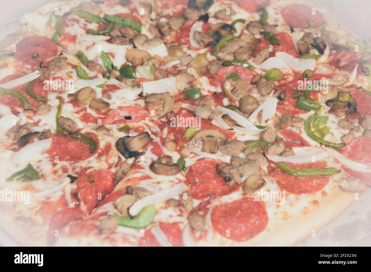 Photograph of a pepperoni, mushroom, pepper and onion pizza Stock Photo Alamy