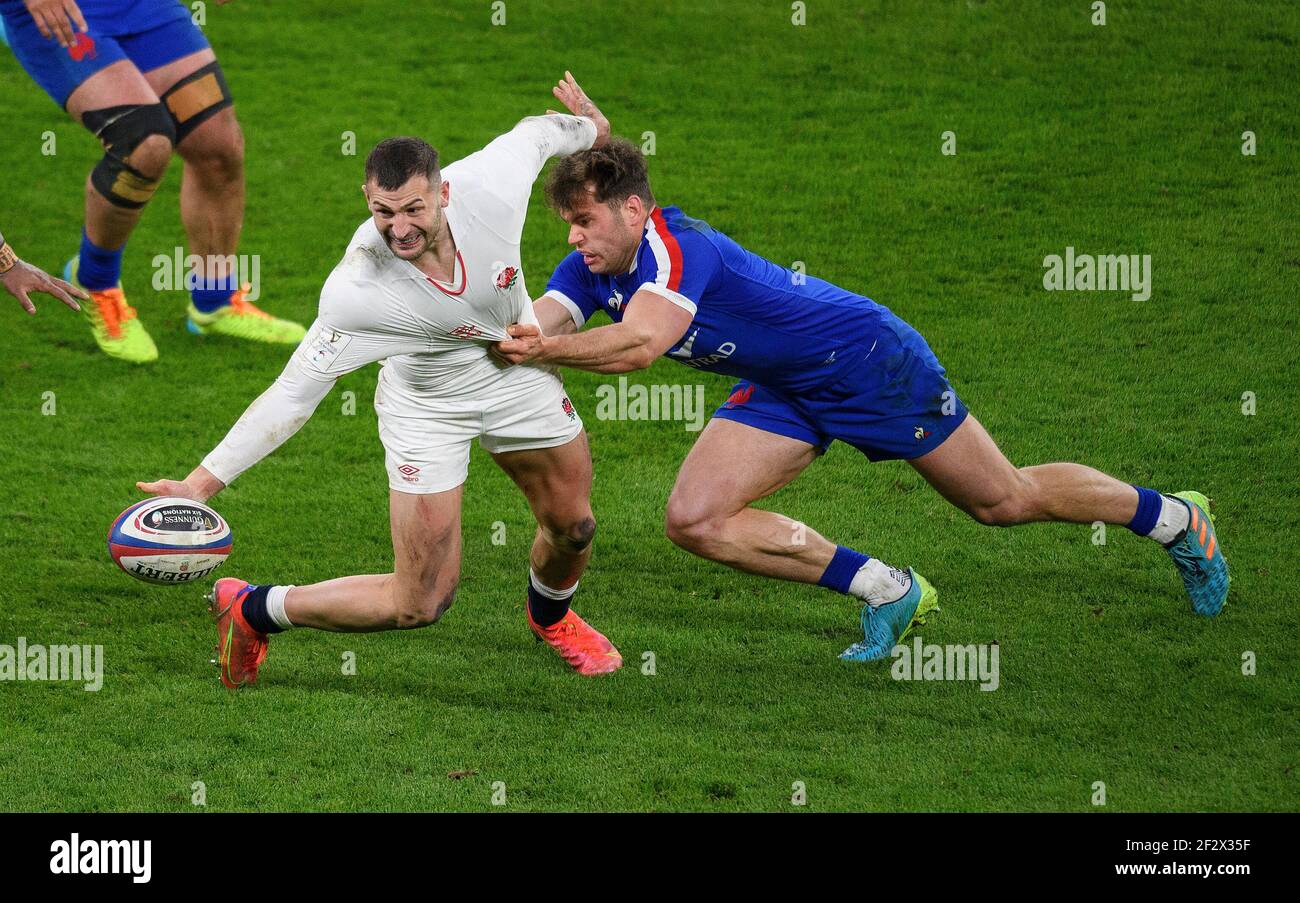 Twickenham Stadium, 13th Mar 2021  England's Jonny May evades a tackle by Damian Penaud during the Guinness Six Nations match at Twickenham Stadium, London Picture Credit : © Mark Pain / Alamy Live News Stock Photo