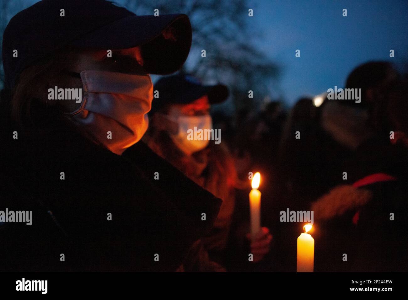 London, UK, 13 March 2021: Despite Metropolitan Police warnings hundreds of people gathered on Clapham Common at the bandstand as a vigil for  the murdered woman Sarah Everard and to protest more generally about police and society's attitudes to male violence and women's freedom. Anna Watson/Alamy Live News Stock Photo