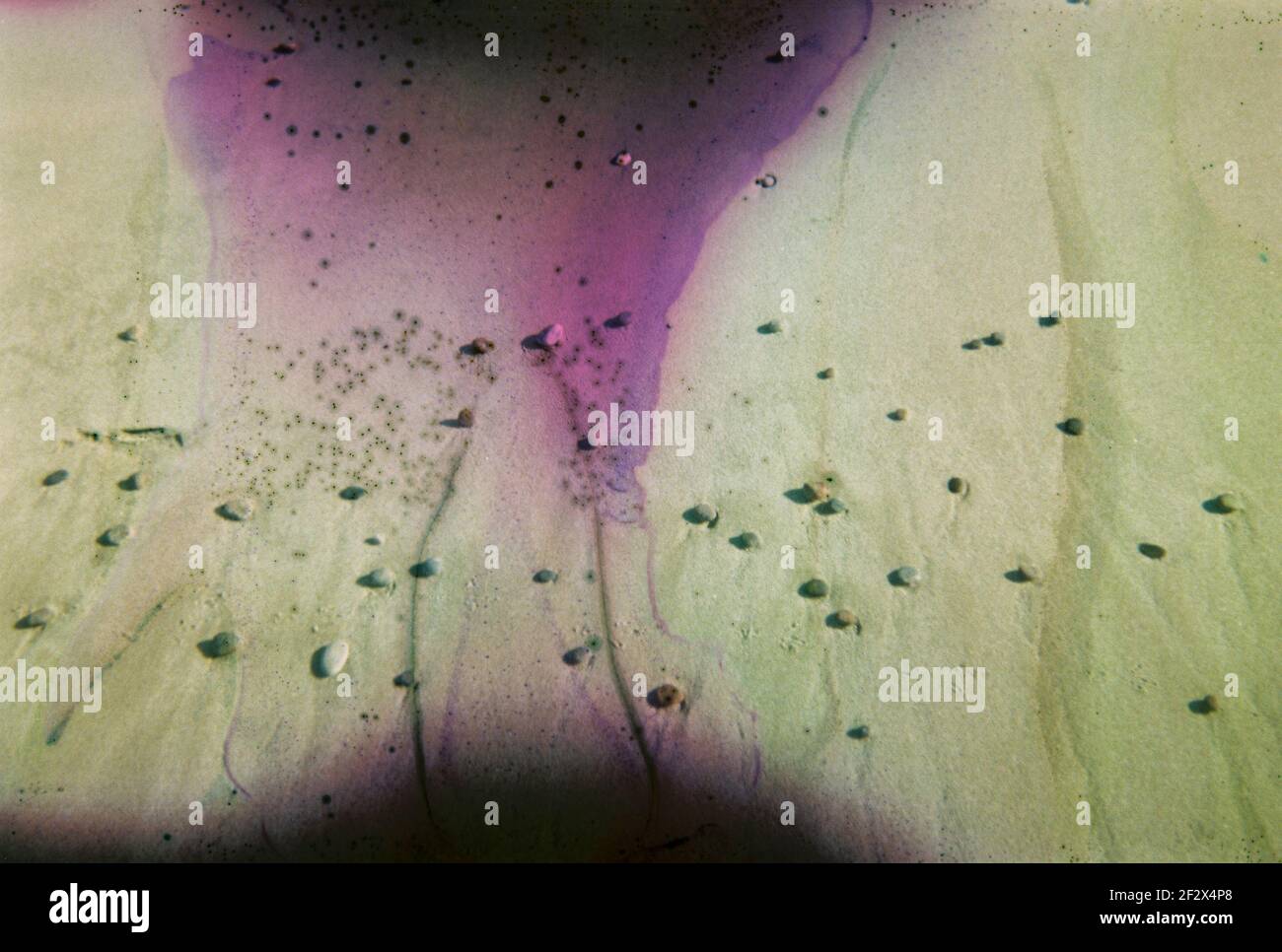 Damaged and blurry photo of beach sand with stains and scratches ...