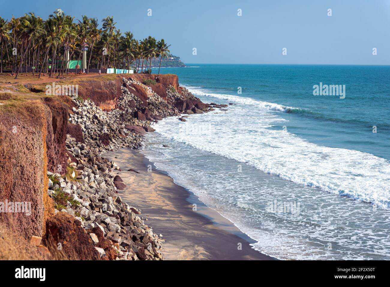 Varkala, Kerala, India. Steep coast, palm trees and sea horizon. 2 km to the North from the Central Beach. Stock Photo