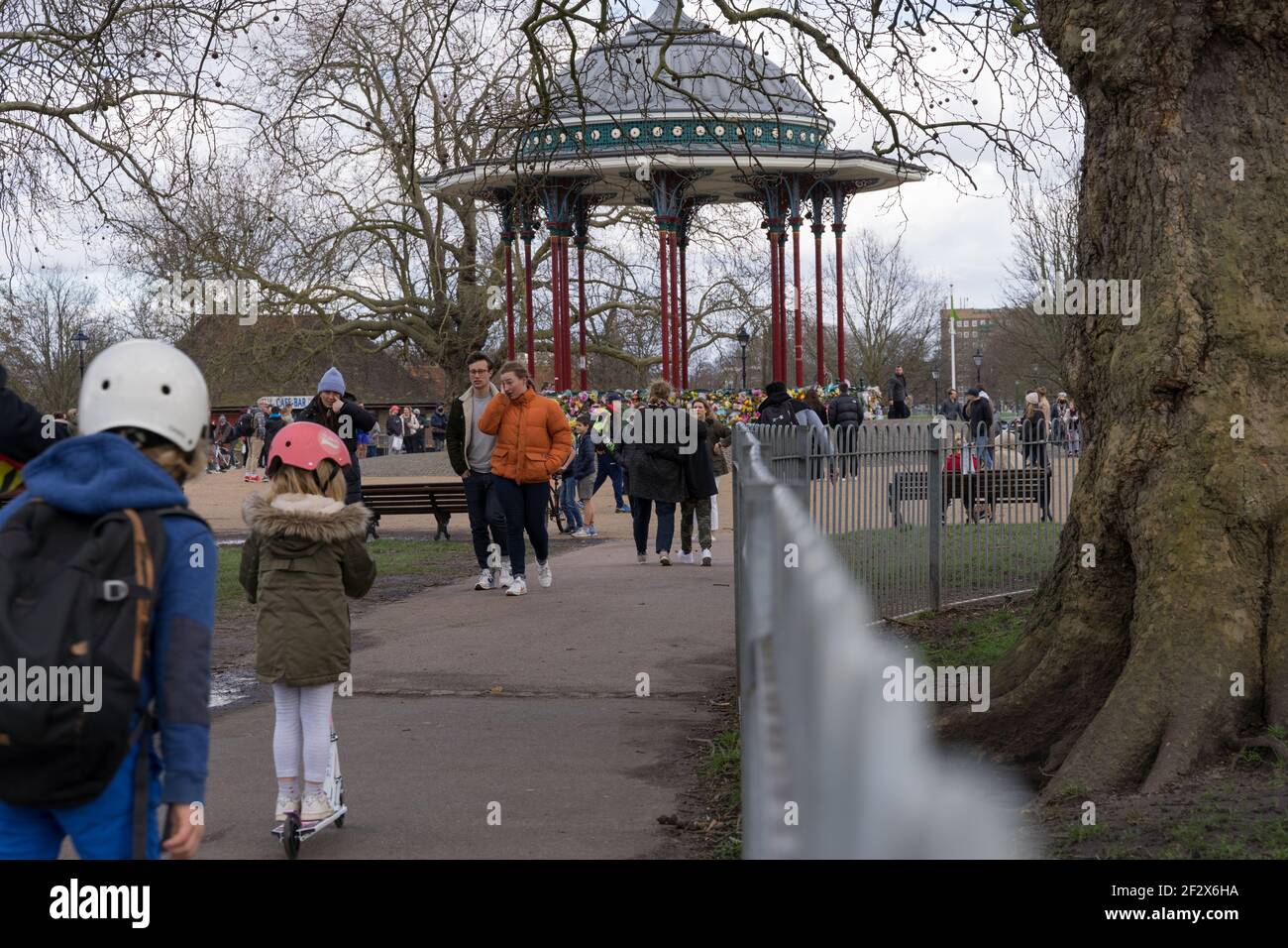 Poeple come to pay floral tributes at Clapham Common bandstand in memory of Sarah Everard, kidnaped and murdered , London, England Stock Photo