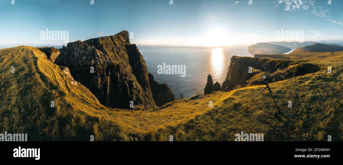 Aerial drone panorama view on Faroe Islands Suduroy towards Beinisvord during sunset. Stock Photo