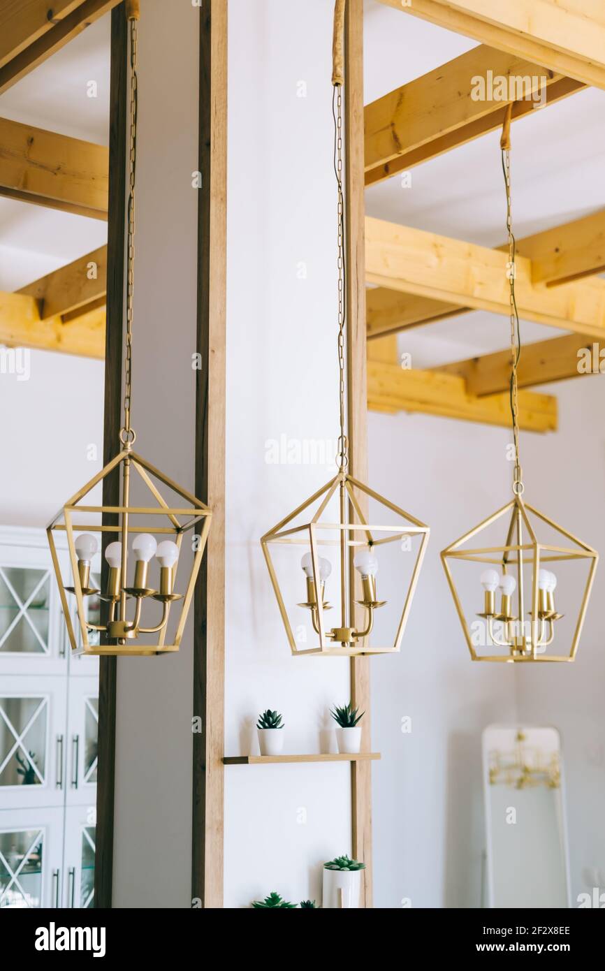 Creative golden metal lampshade in modern kitchen Stock Photo Alamy