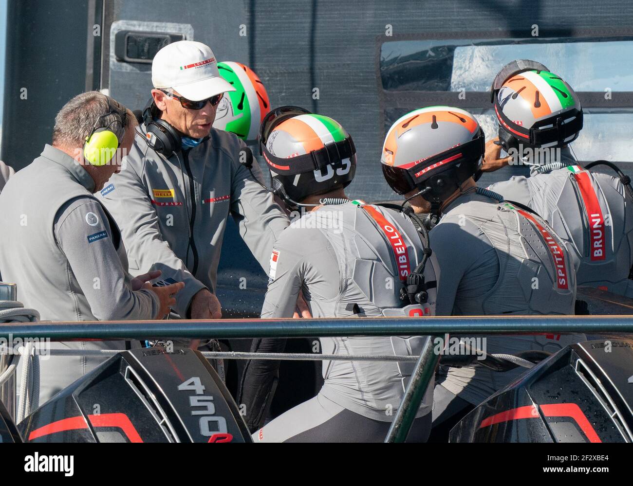 Auckland, New Zealand, 13 March, 2021 - Italian challengers Luna Rossa  Prada Pirelli, co-helmed by Jimmy Spithill and Francesco Bruni on Luna  Rossa, with tactician Pietro Sibello listen to coaches Vascoe Vizconi (