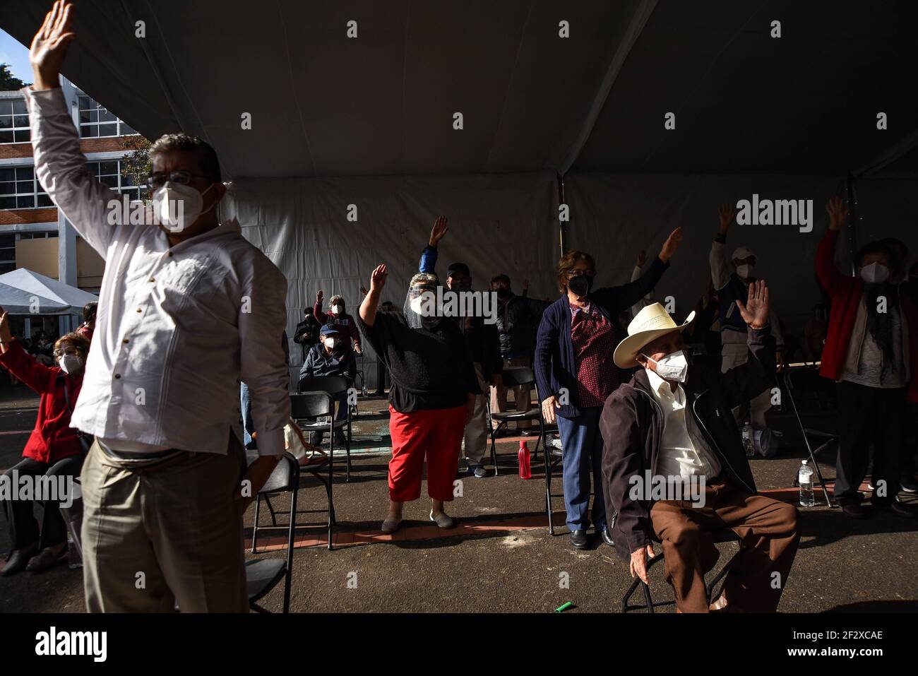 Xalapa, Mexico. March 13, 2021: Thousands of older adults received the COVID-19 vaccine in the city of Xalapa. From early on they made lines and for their application they were sanitized and did body activation exercises. Credit: Hector Adolfo Quintanar Perez/ZUMA Wire/Alamy Live News Stock Photo