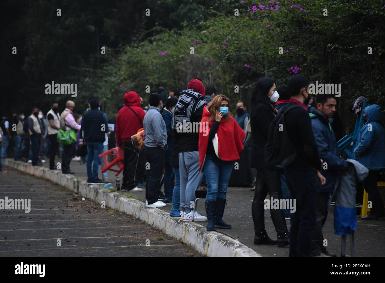Xalapa, Mexico. March 13, 2021: Thousands of older adults received the COVID-19 vaccine in the city of Xalapa. From early on they made lines and for their application they were sanitized and did body activation exercises. Credit: Hector Adolfo Quintanar Perez/ZUMA Wire/Alamy Live News Stock Photo