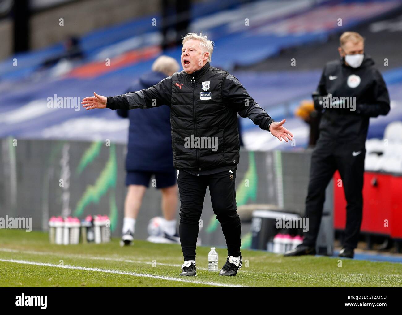 Selhurst Park, London, UK. 13th Mar, 2021. English Premier League Football, Crystal Palace versus West Bromwich Albion; West Bromwich Albion Assistant Coach Sammy Lee shouting instructions to the West Bromwich Albion players from the touchline Credit: Action Plus Sports/Alamy Live News Stock Photo