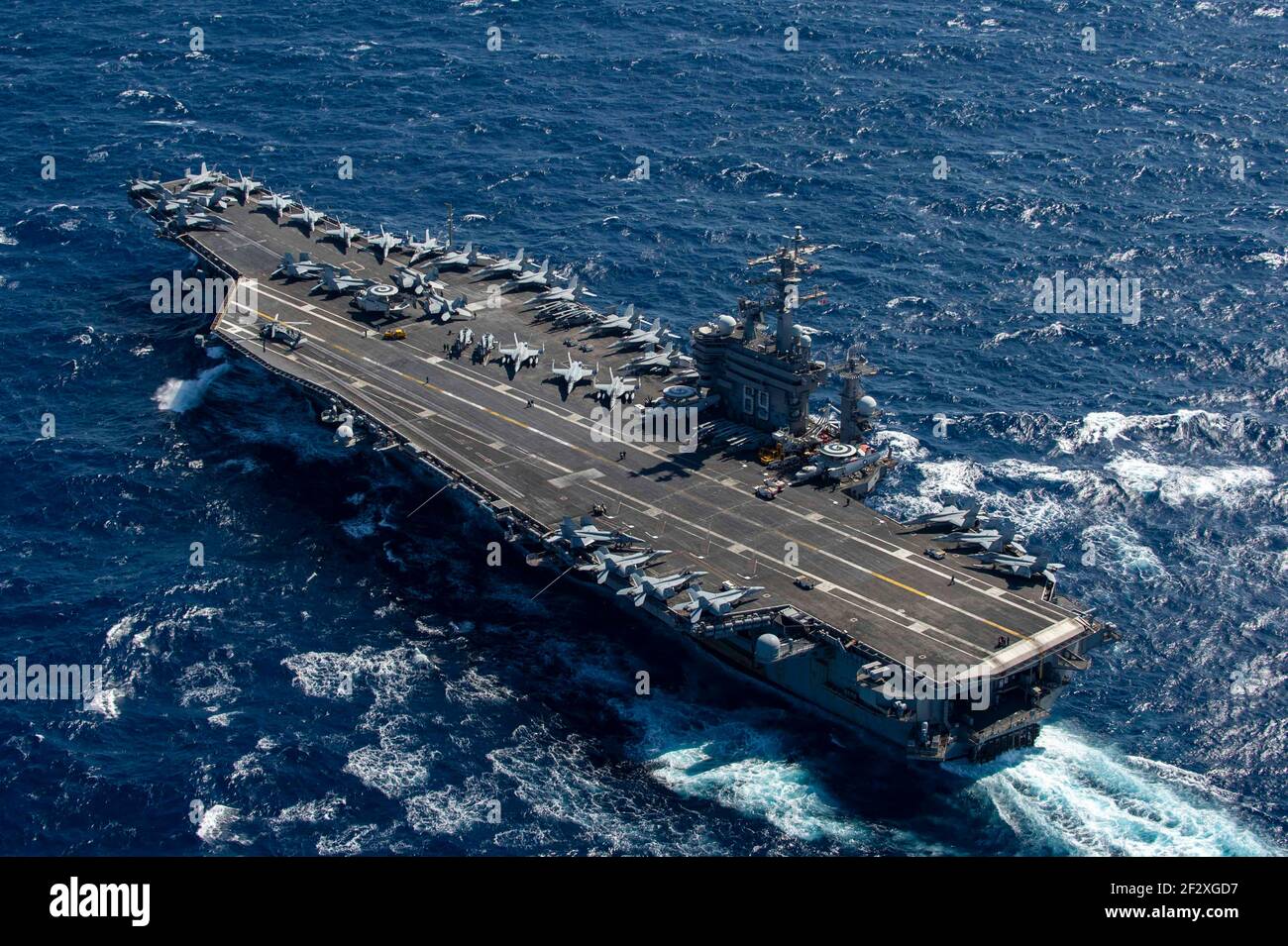 The U.S. Navy Nimitz-class aircraft carrier USS Dwight D. Eisenhower transits the Mediterranean Sea on a routine deployment in the U.S. 6th Fleet area of operations March 11, 2021 in the Mediterranean Sea. Stock Photo