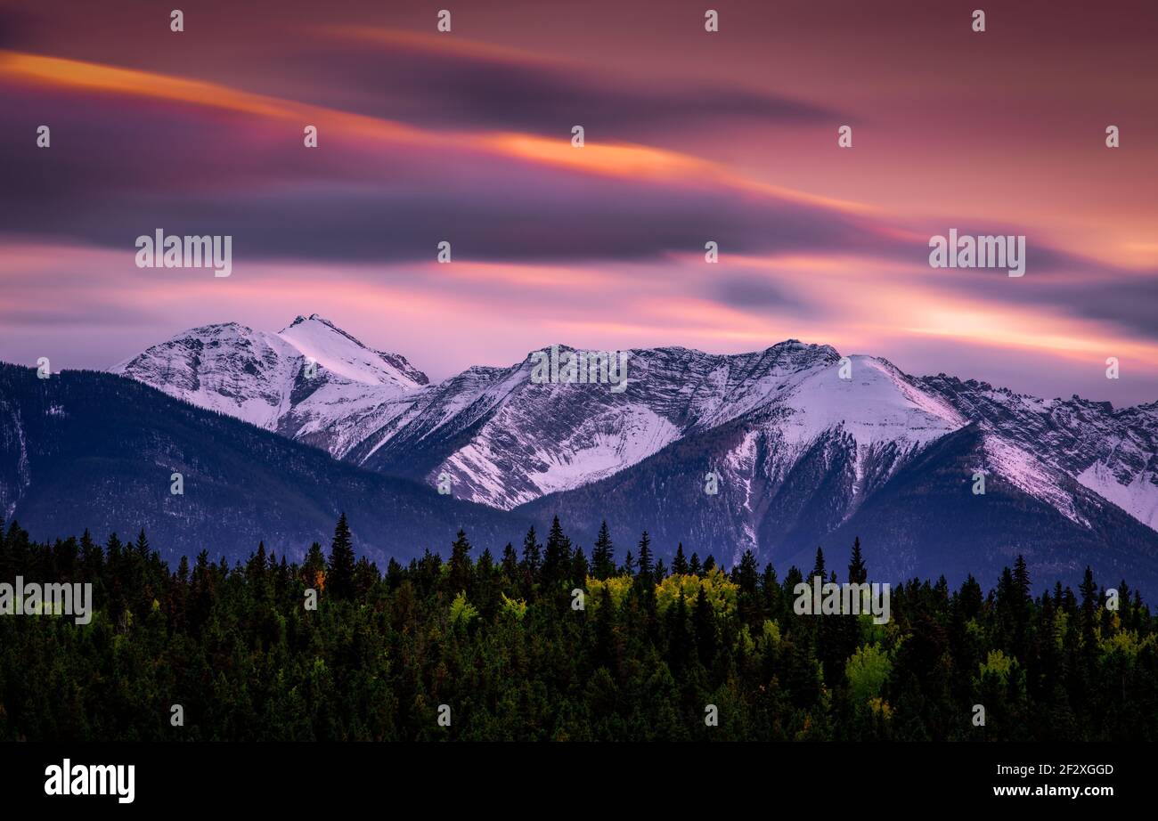 A colorful evening sky over the Canadian Rockies in Banff National Park. Stock Photo