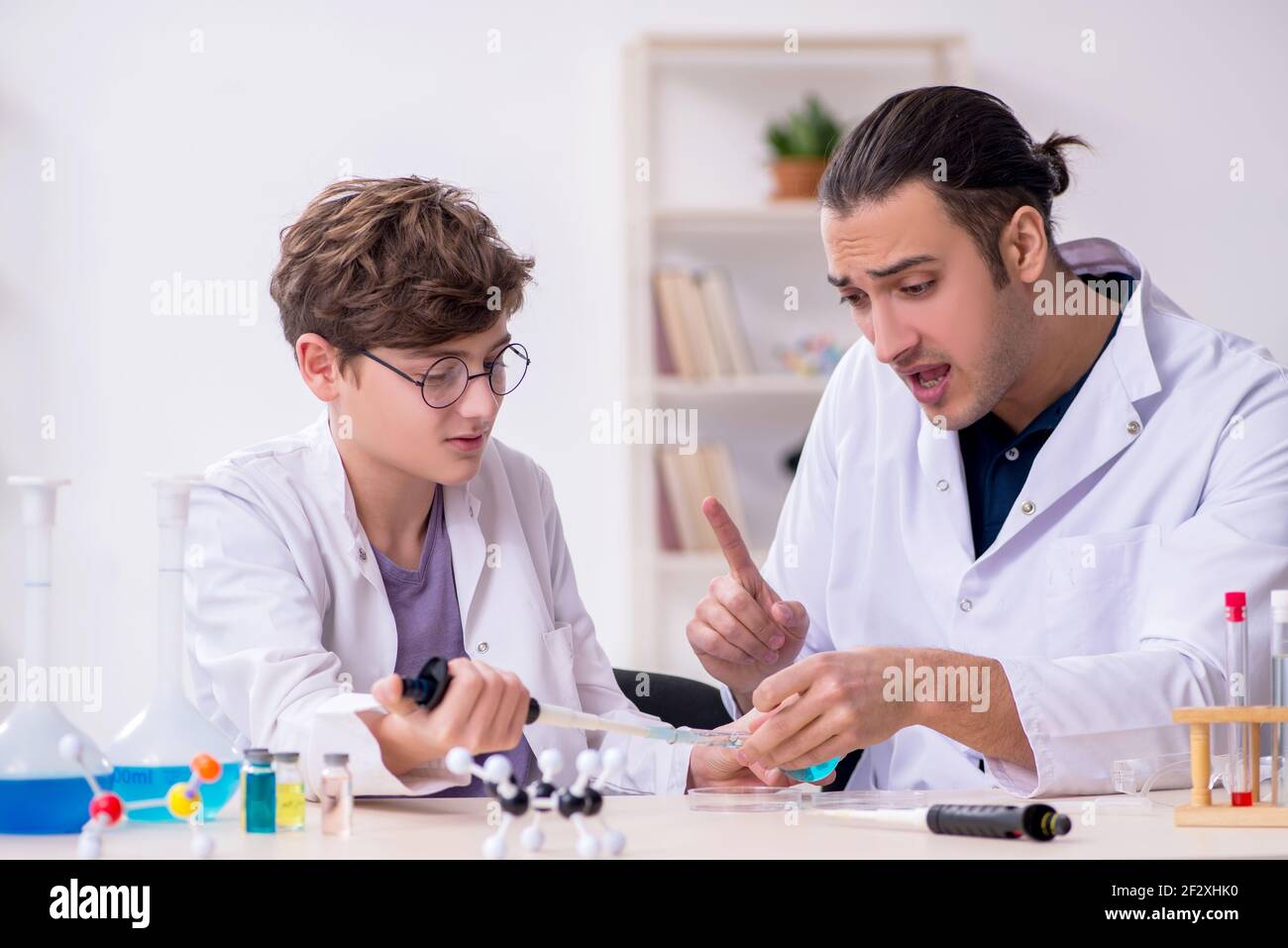 Young father and son chemists in the laboratory Stock Photo - Alamy
